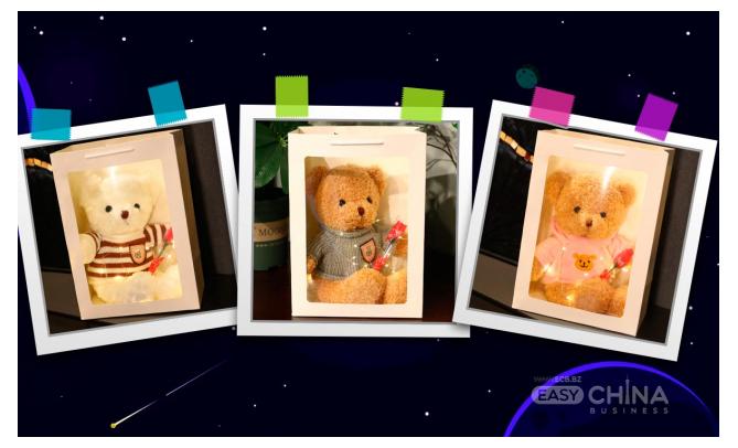 Фото товара Плюшевый мишка с цветком в подарочной коробке