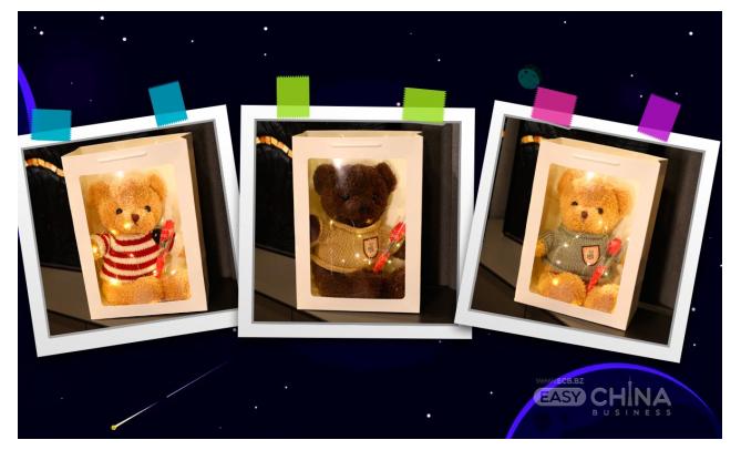 Фото товара Плюшевый мишка с цветком в подарочной коробке